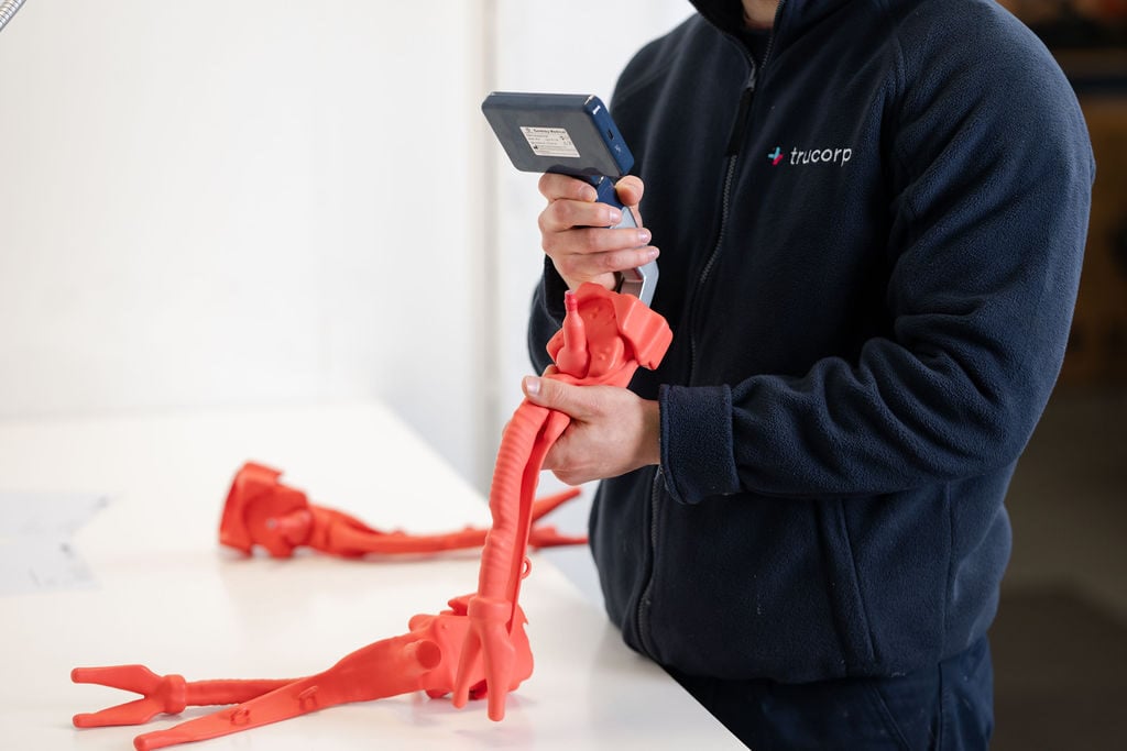 Product specialist inspecting airway components during product testing.