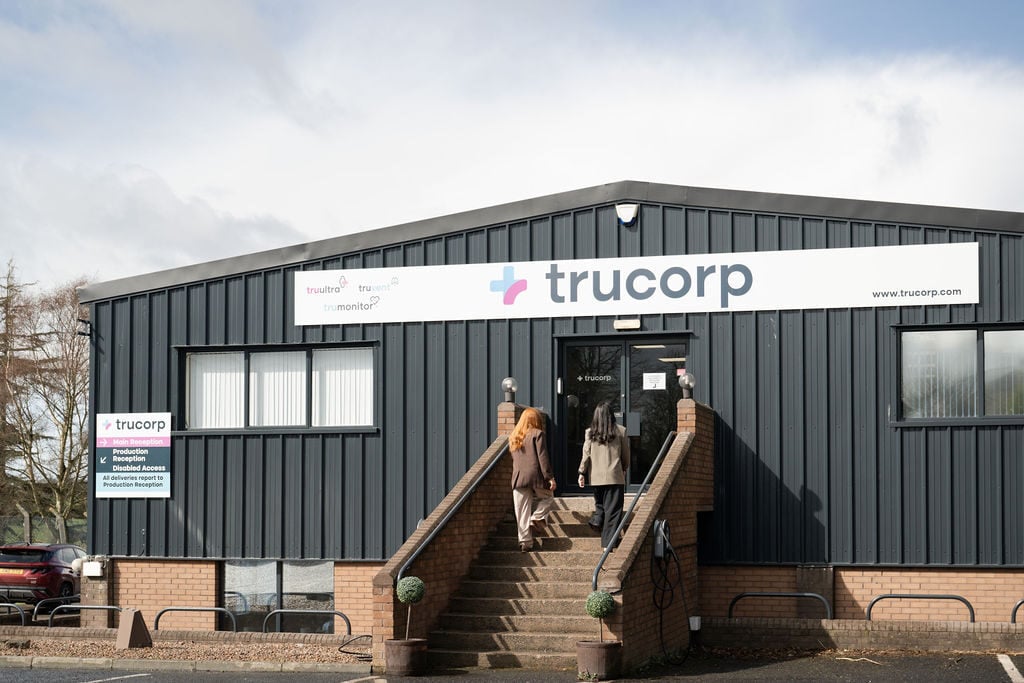 Exterior of TruCorp headquarters with company signage